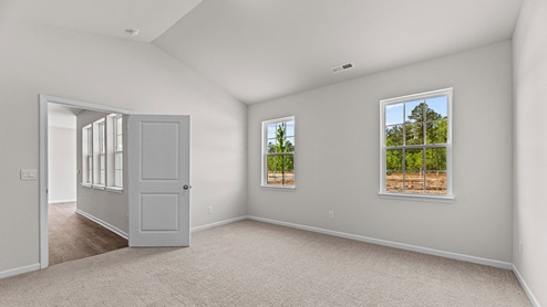 bedroom with carpet and ample light