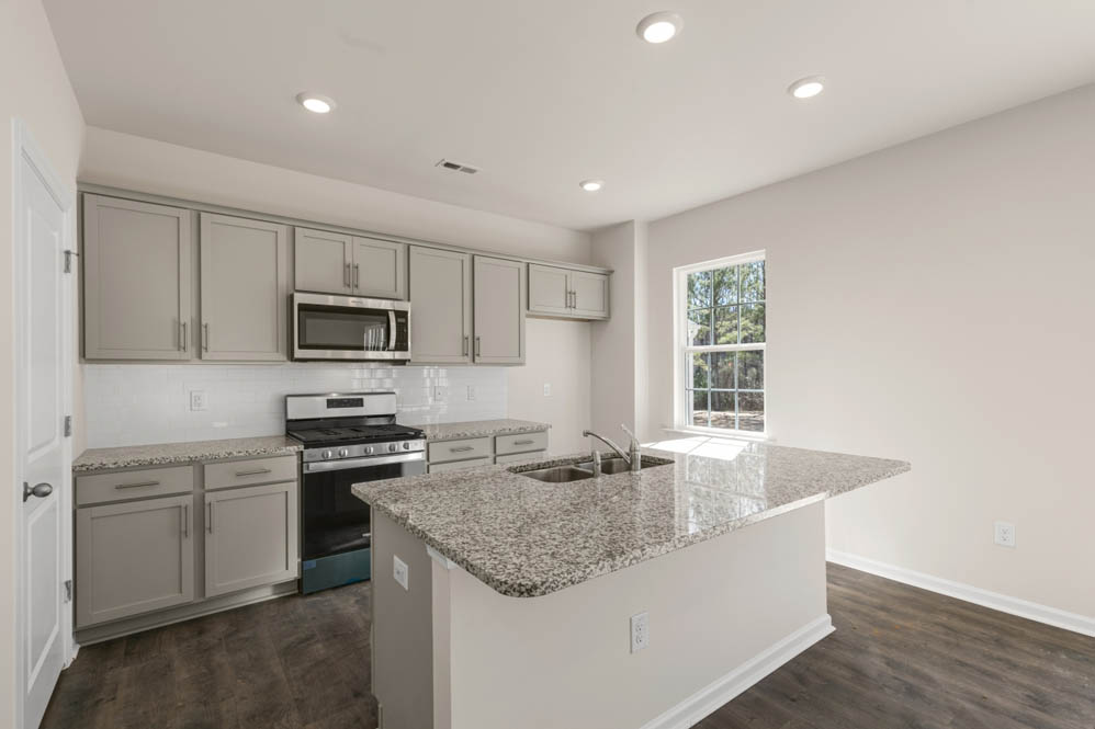 kitchen with island and revwood floors