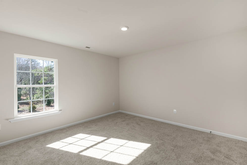 bedroom with carpet and natural light