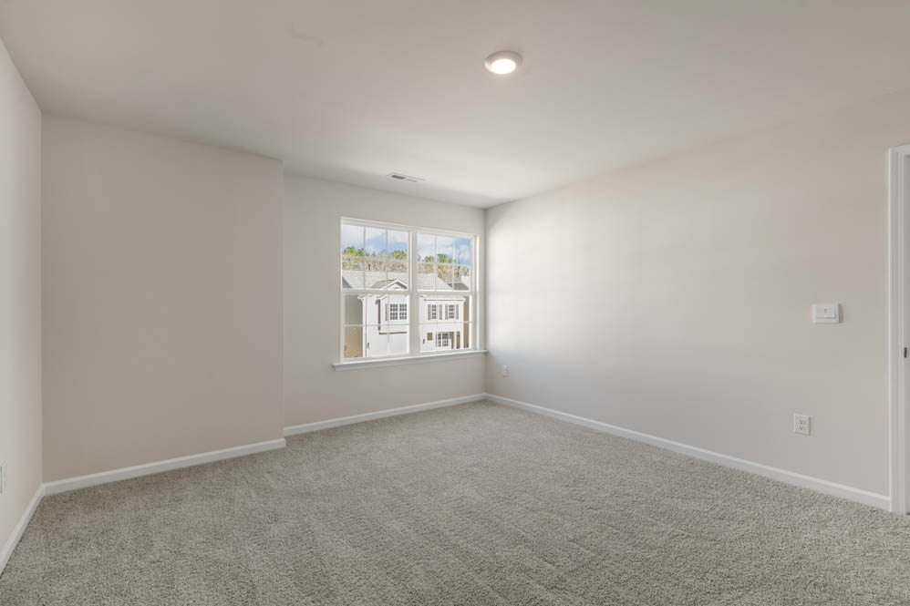 bedroom with carpet and natural light