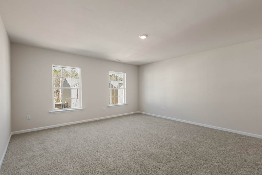 bedroom with carpet and natural light