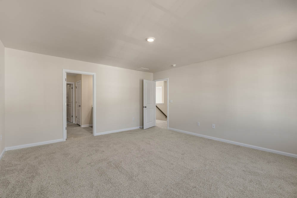 bedroom with carpet and natural light