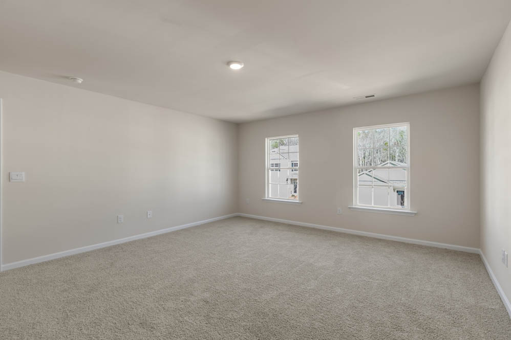 bedroom with carpet and natural light