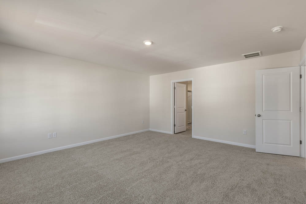 bedroom with carpet and natural light