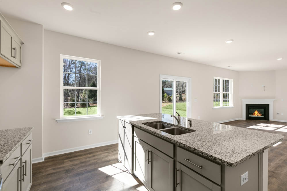 kitchen with island and revwood floors