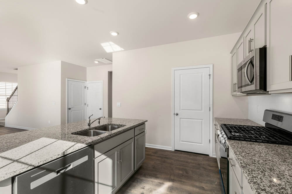 kitchen with island and revwood floors