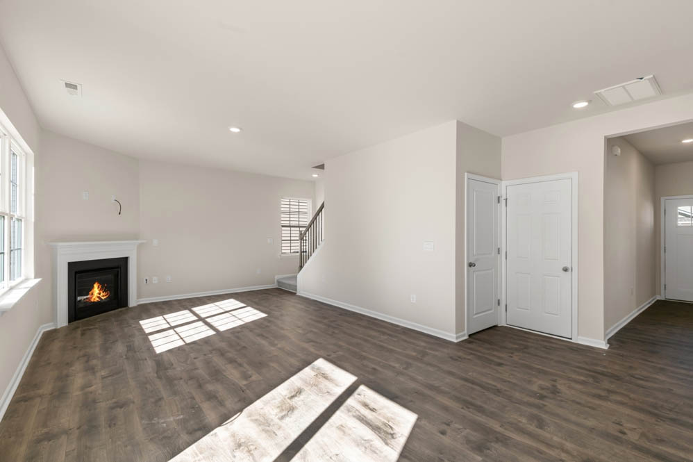 living room with revwood floors and natural light