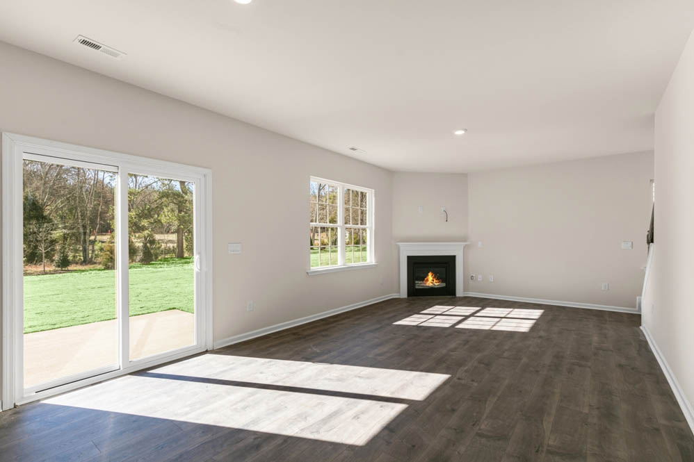 living room with revwood floors and natural light