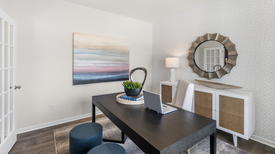 Study with revwood flooring and ample light