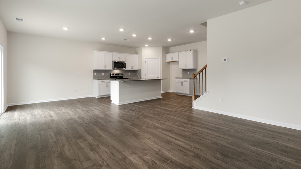 living room with partial kitchen view
