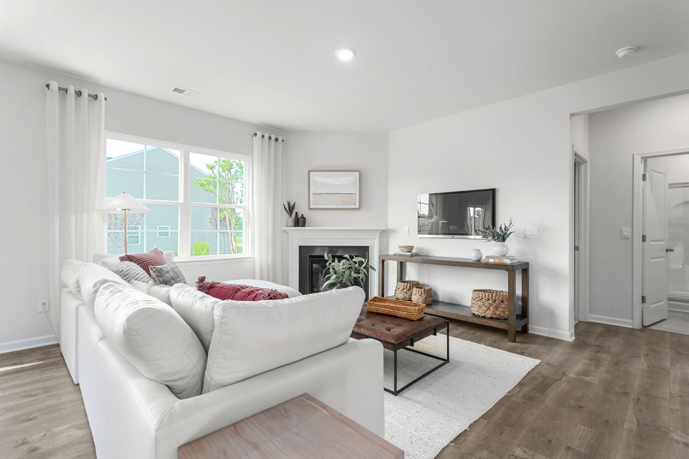 living room with revwood floors and natural light