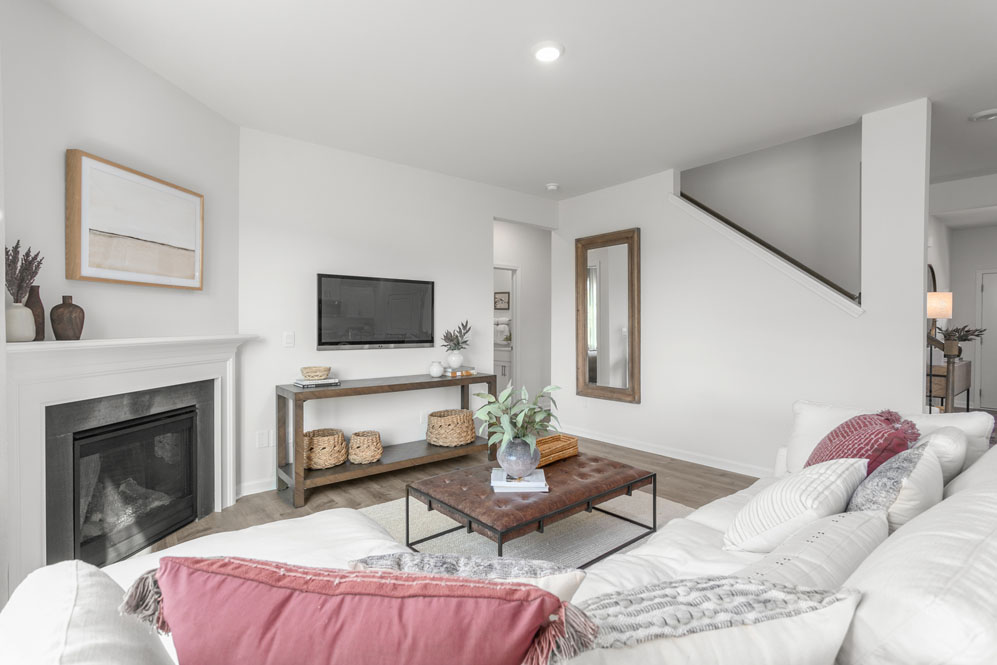 living room with revwood floors and natural light