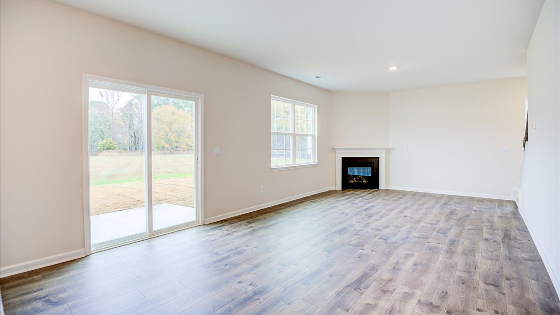 living room with revwood floors and natural light