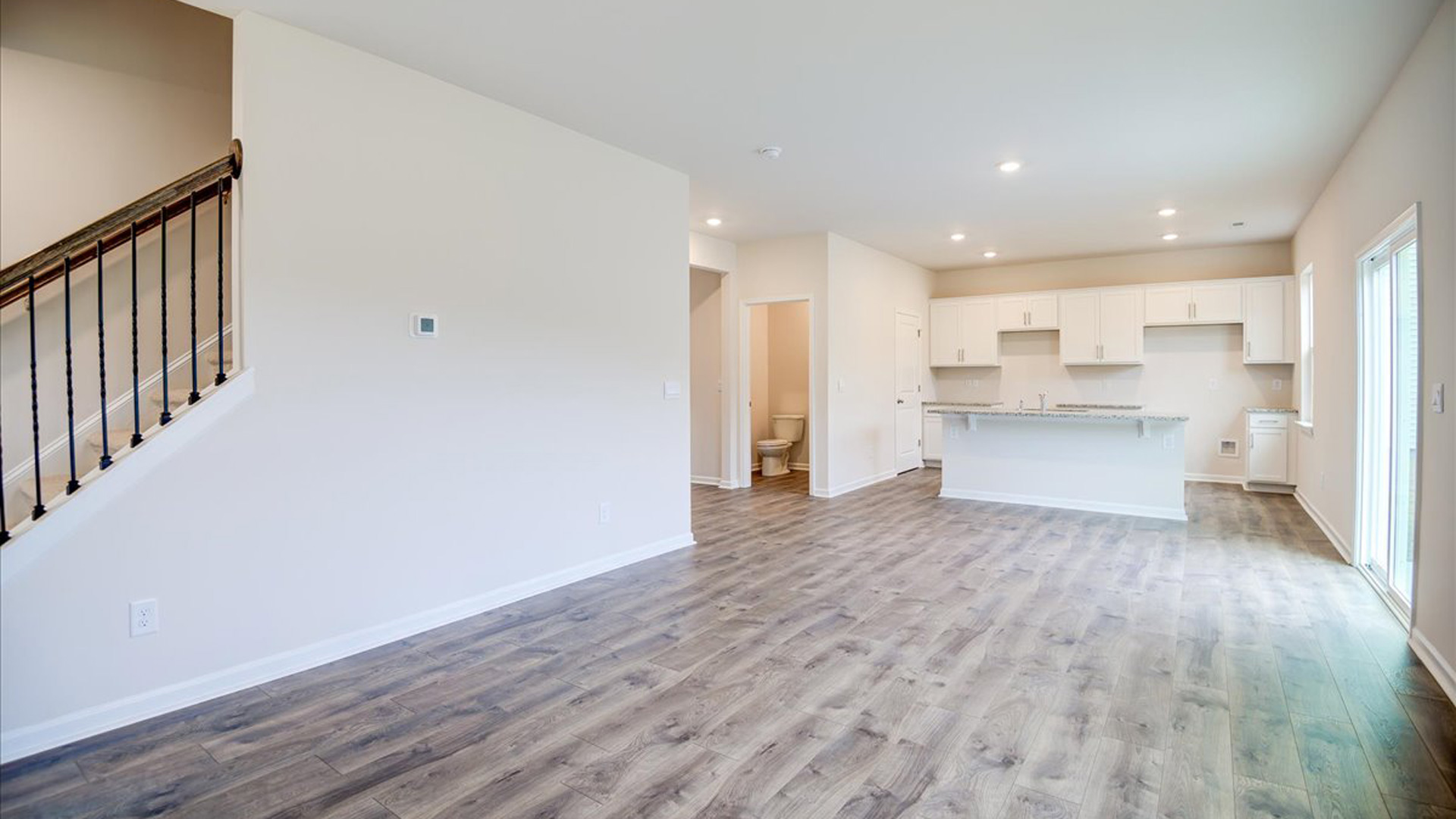 living room with revwood floors and natural light