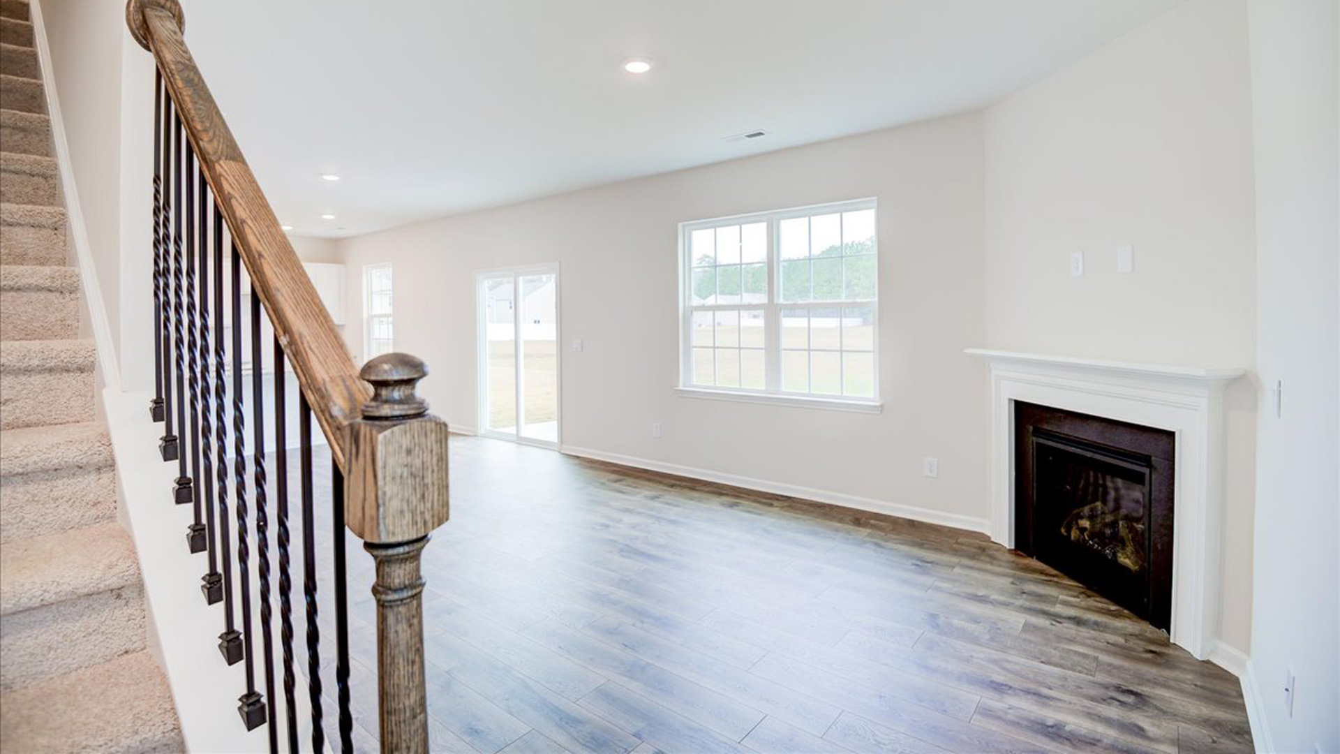 living room with revwood floors and natural light