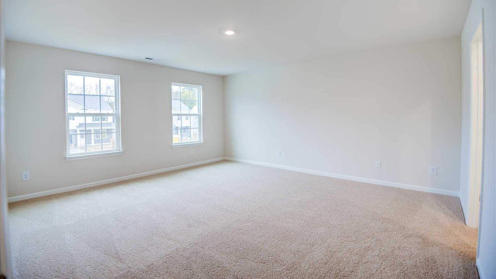 bedroom with carpet and natural light