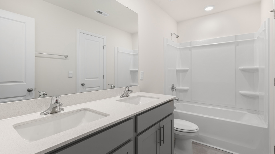 bathroom with dual sinks