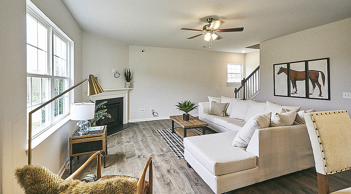 living room with revwood floors and natural light