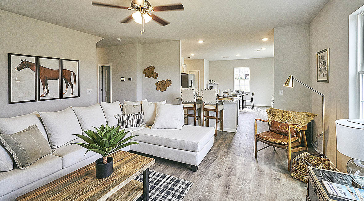 living room with revwood floors and natural light