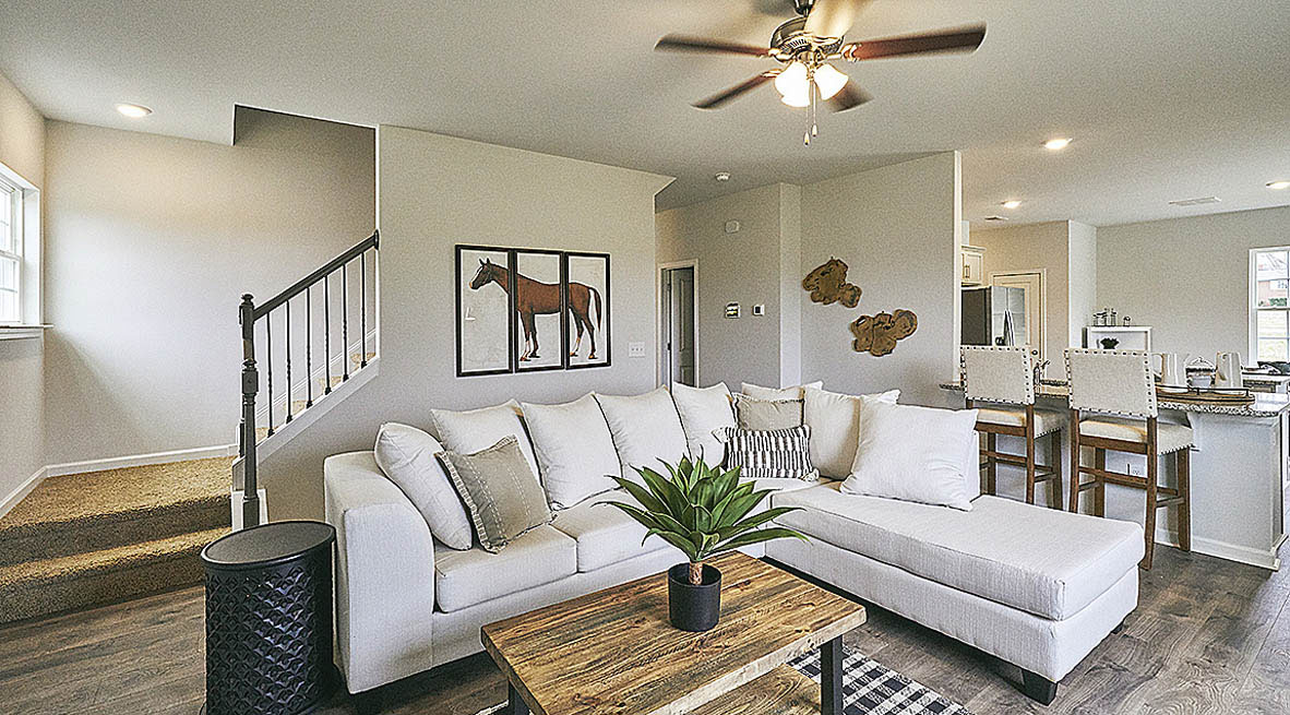 living room with revwood floors and natural light