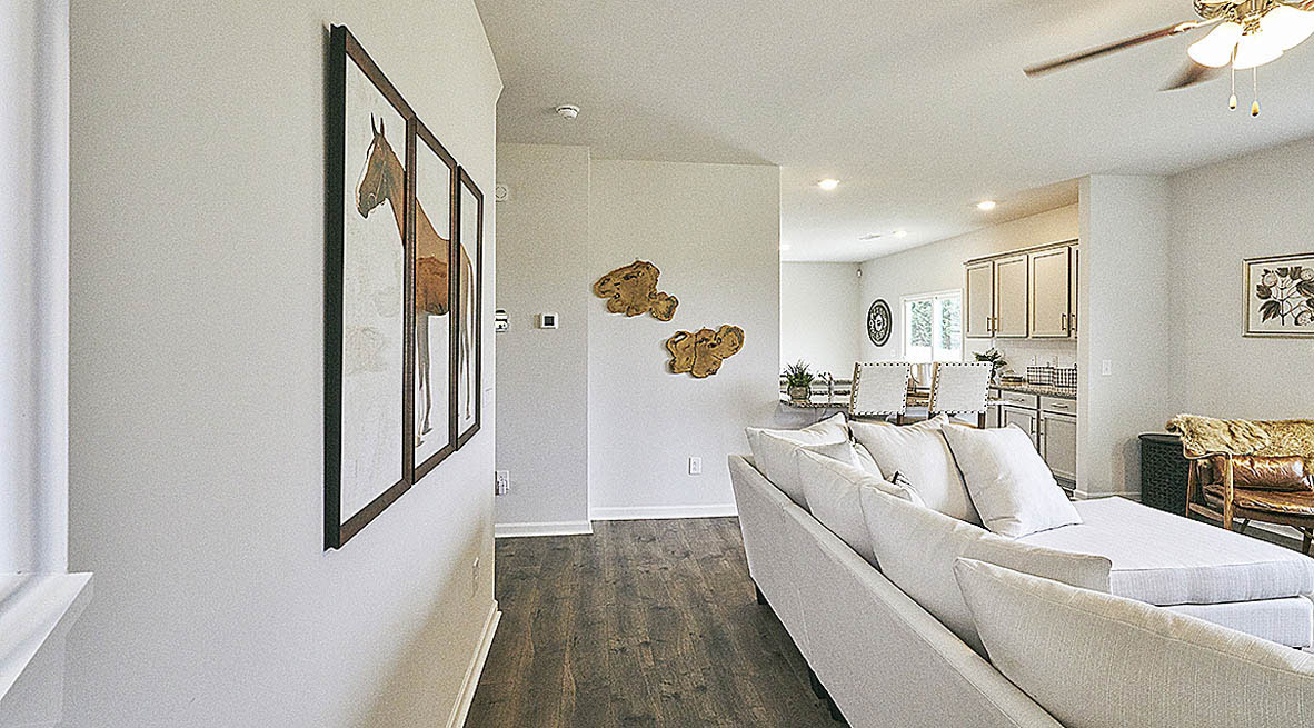 living room with revwood floors and natural light