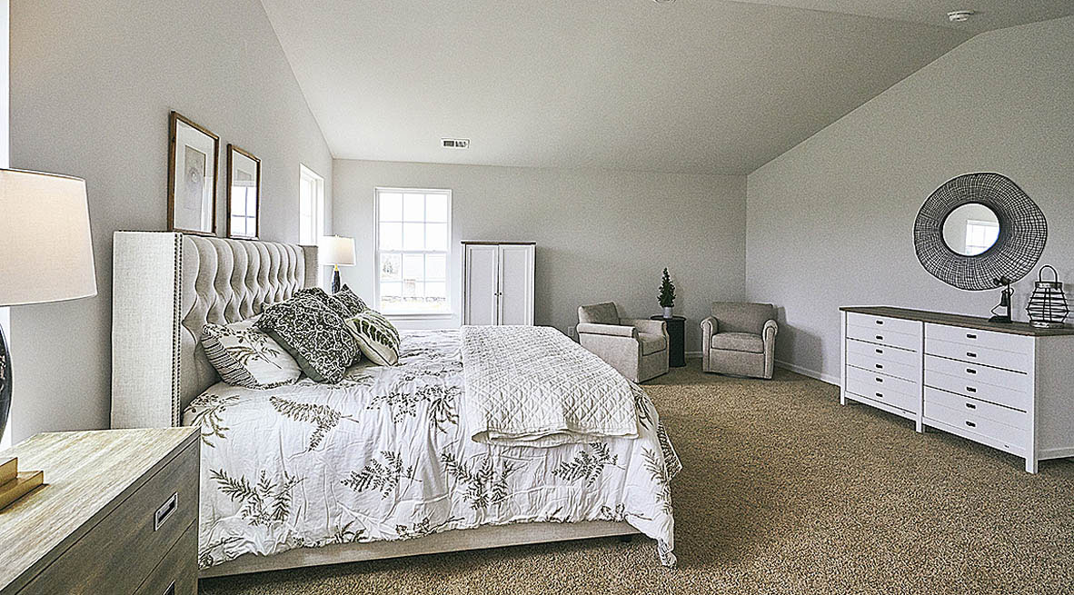 Bedroom with carpet and natural light