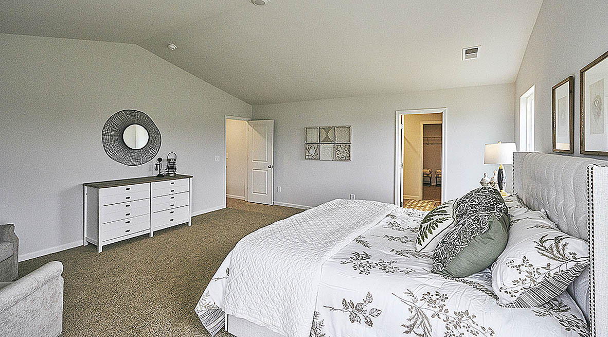 Bedroom with carpet and natural light