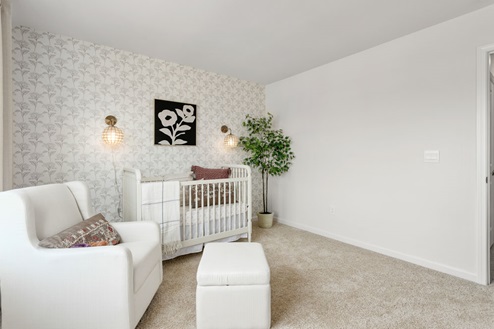 bedroom with carpet and natural light