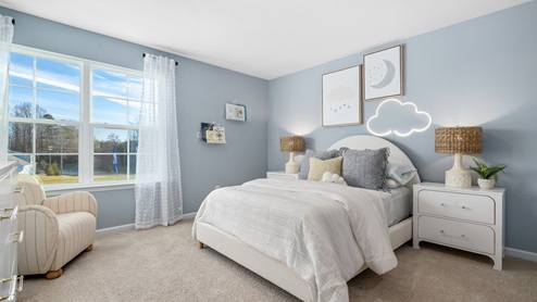 bedroom with a double window and carpet