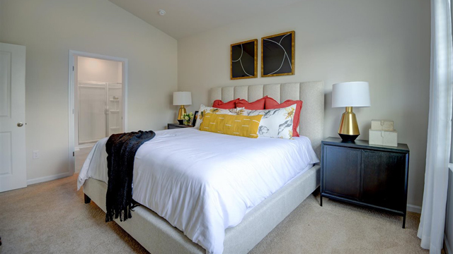 bedroom with carpet and natural light