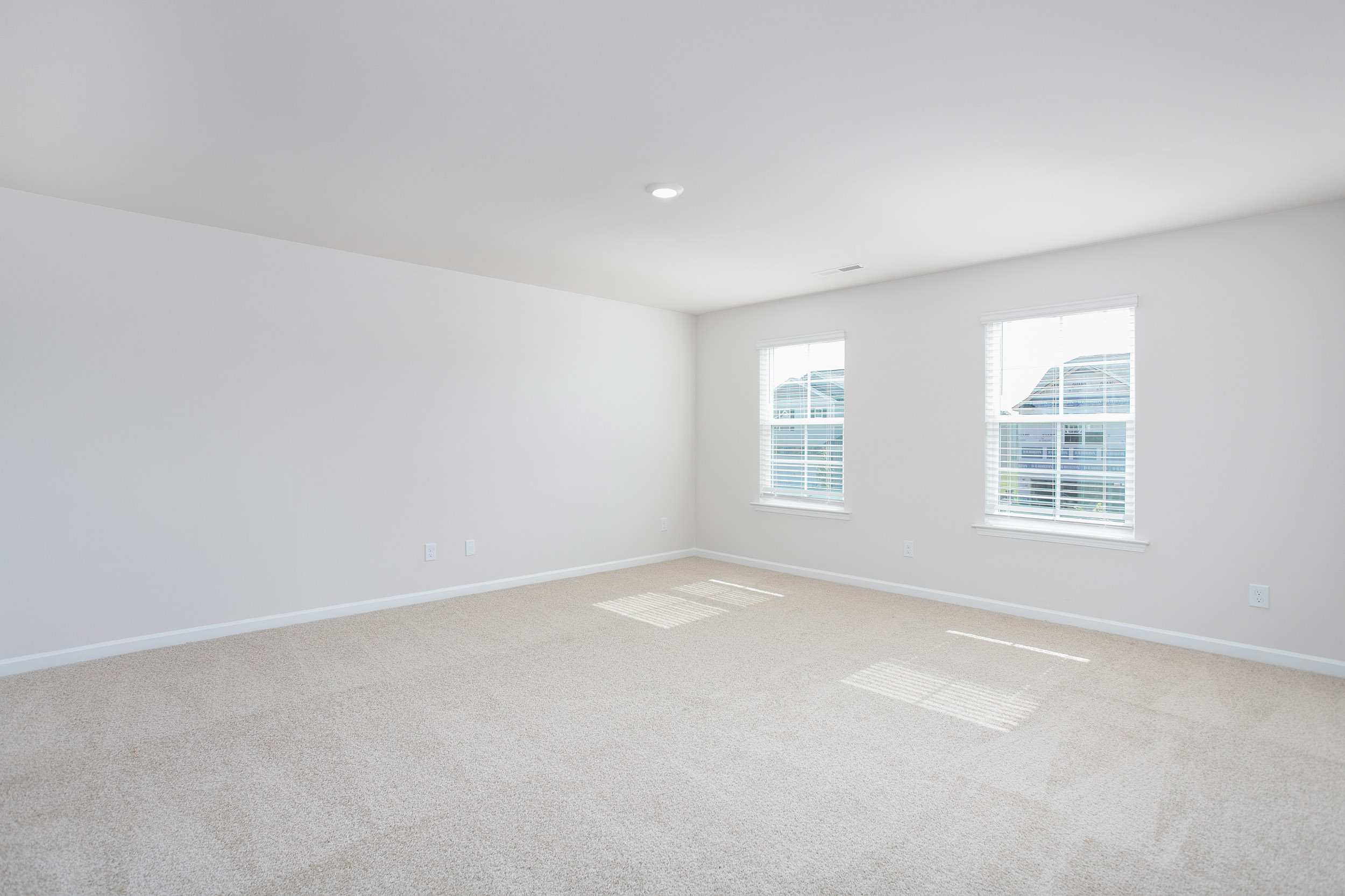 bedroom with carpet and natural light
