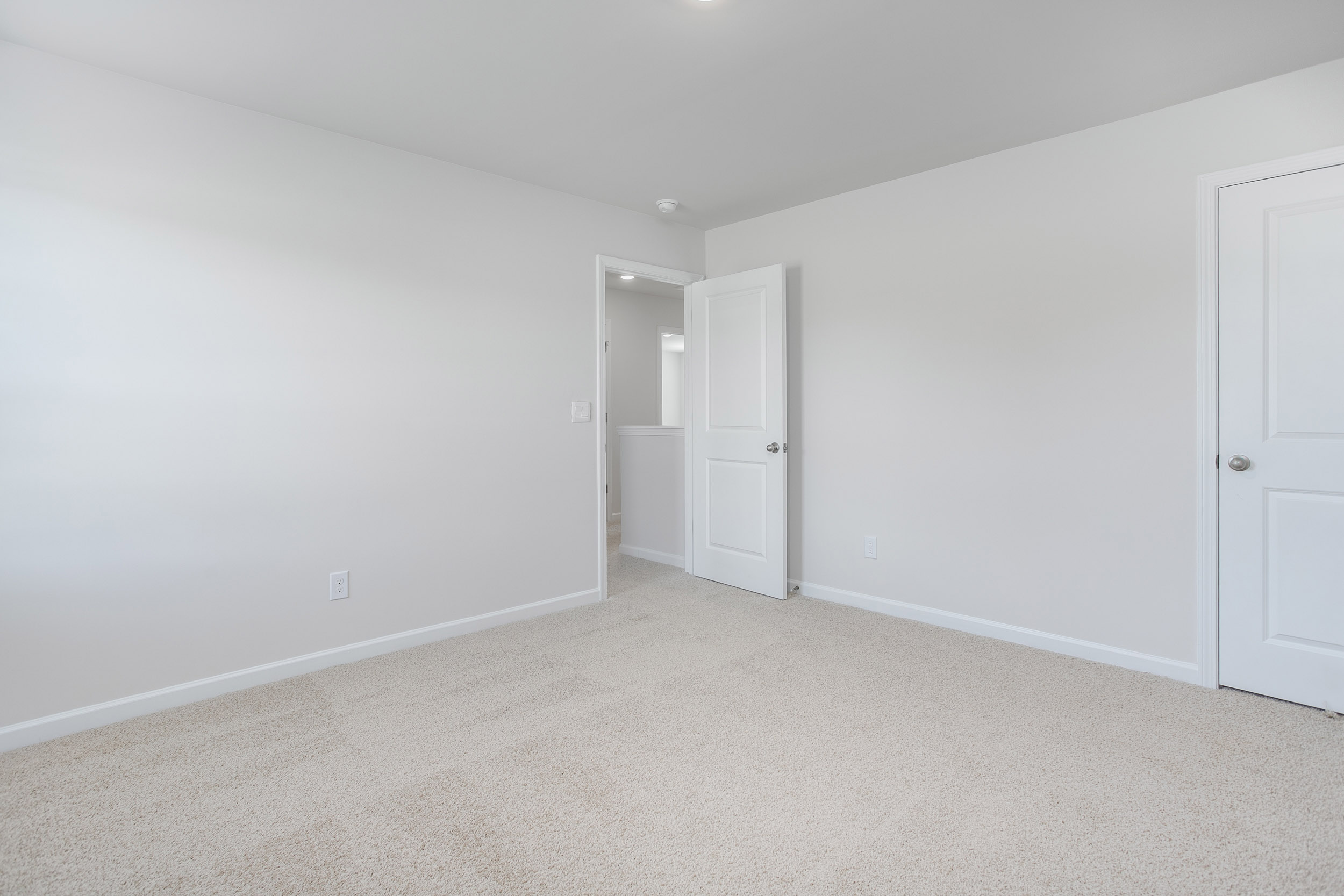 bedroom with carpet and natural light