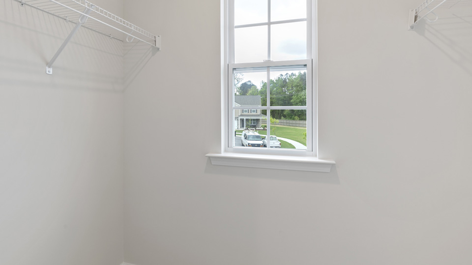 primary walk in closet with window