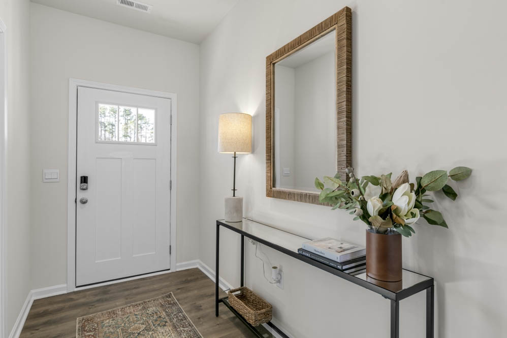 front door with revwood floors
