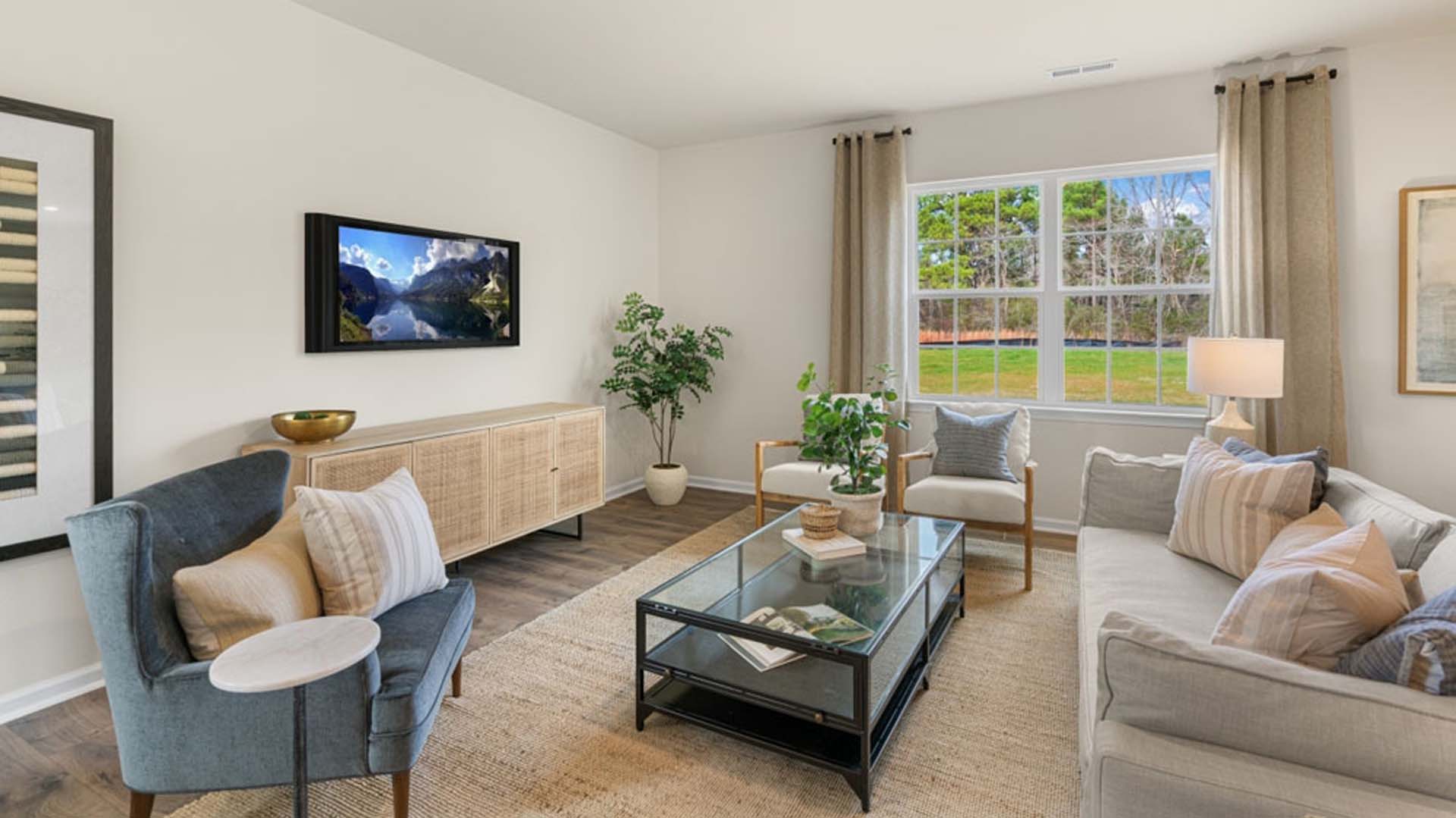 living room with revwood floors and natural light