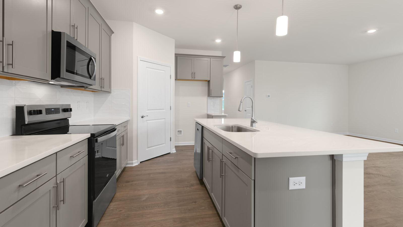 kitchen with stainless steel appliances and white cabinets