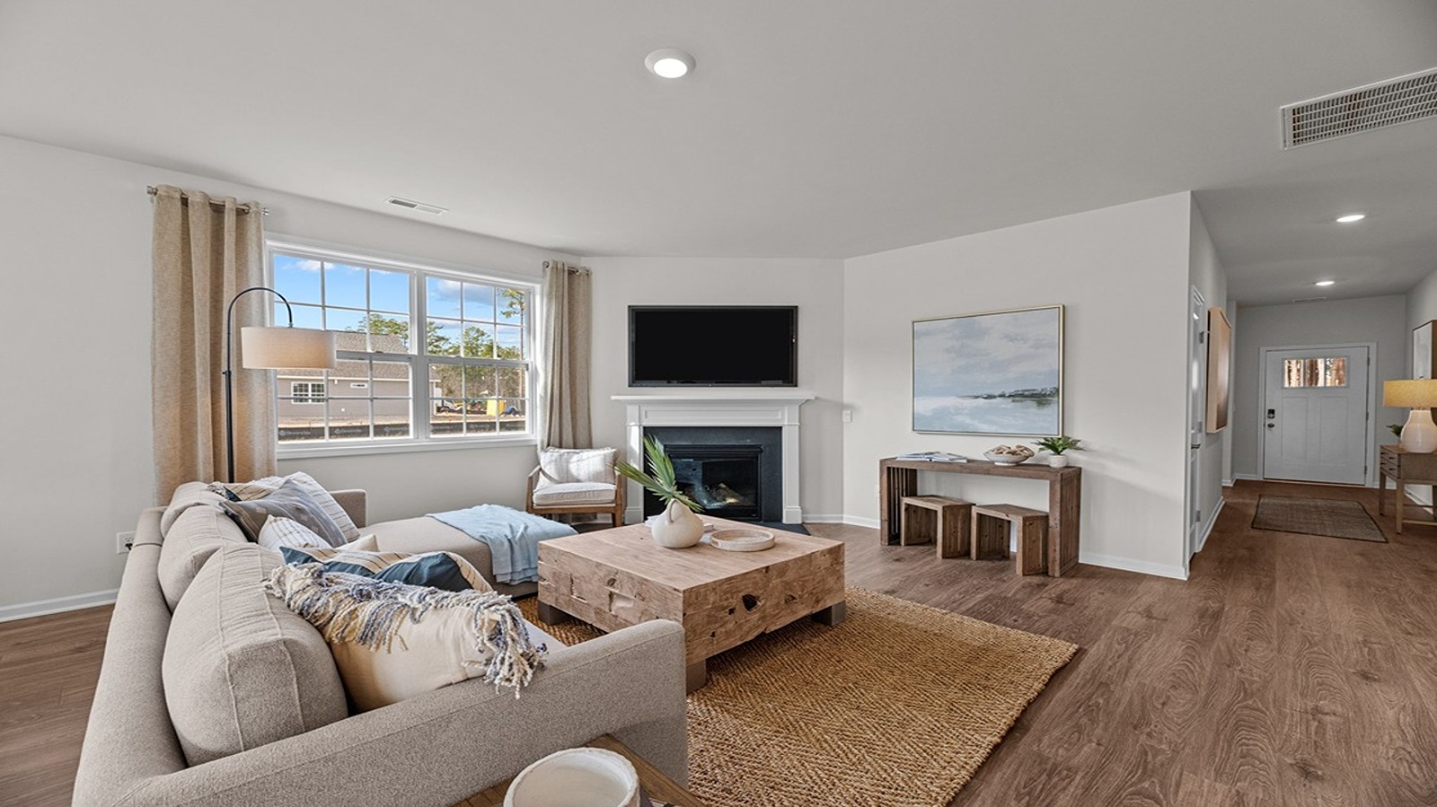 living room open to kitchen and dining area