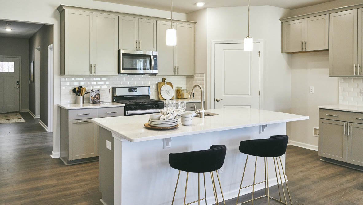 kitchen with island and revwood floor