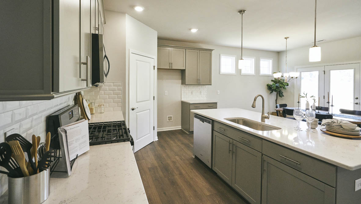 kitchen with island and revwood floor
