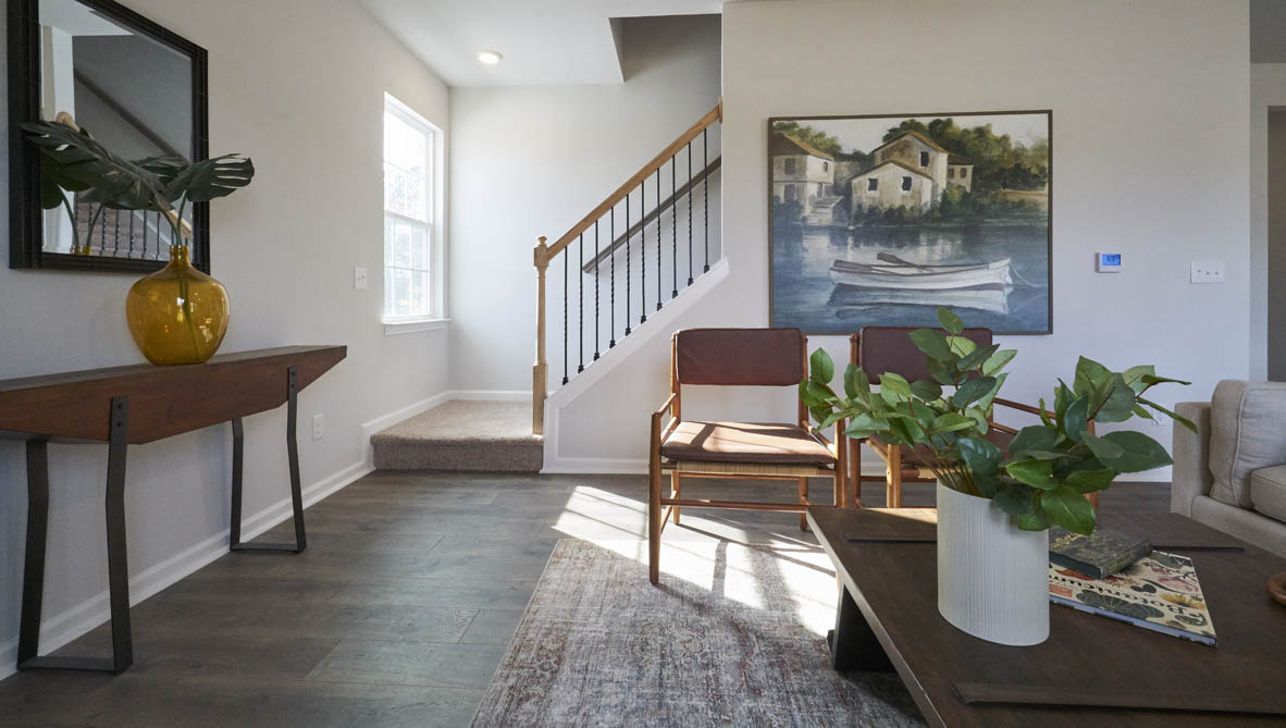 living room with revwood floors and natural light