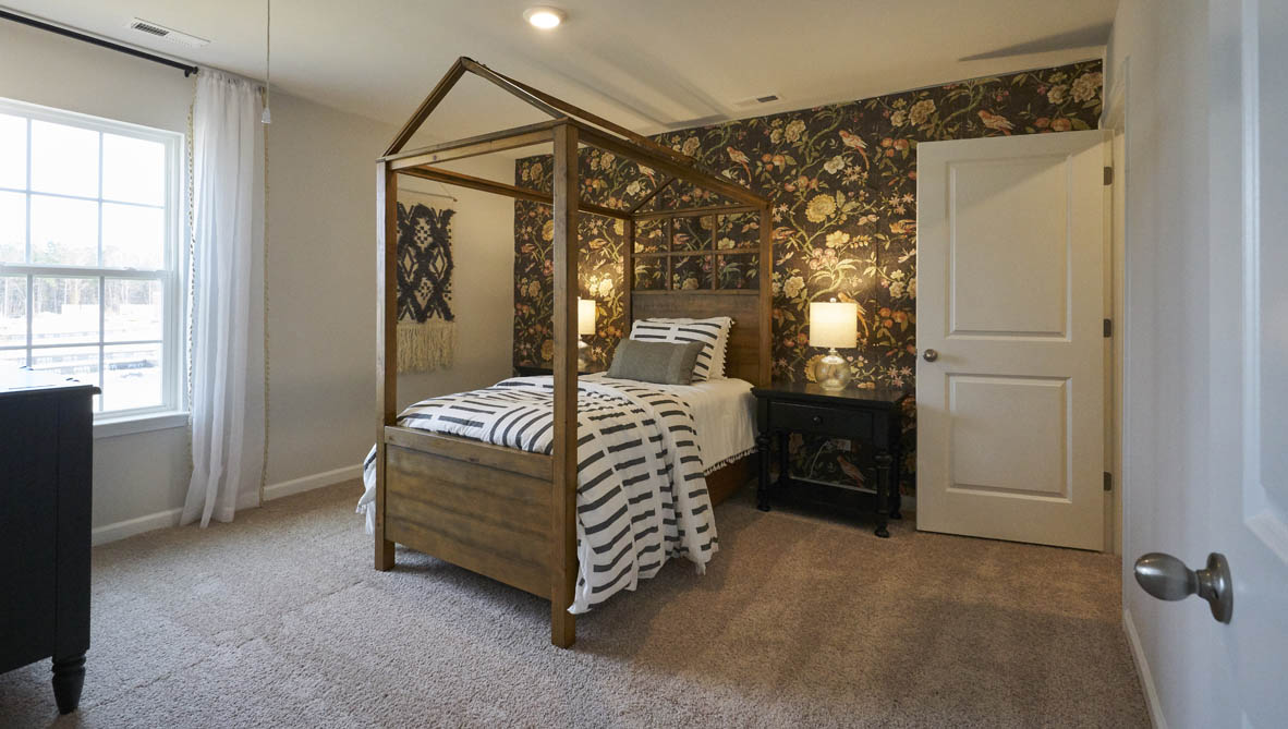 bedroom with carpet and natural light