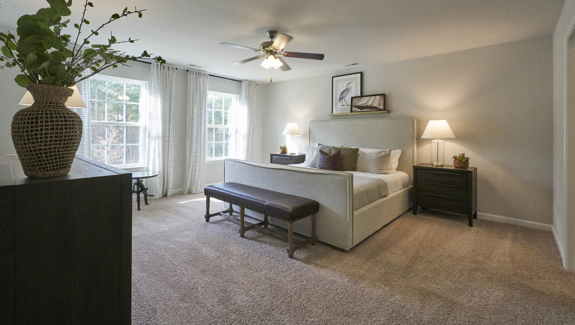 bedroom with carpet and natural light