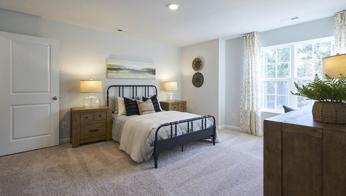 bedroom with carpet and natural light