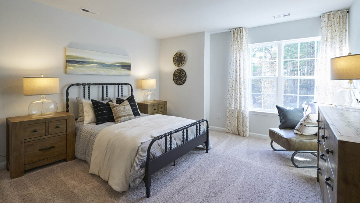 bedroom with carpet and natural light