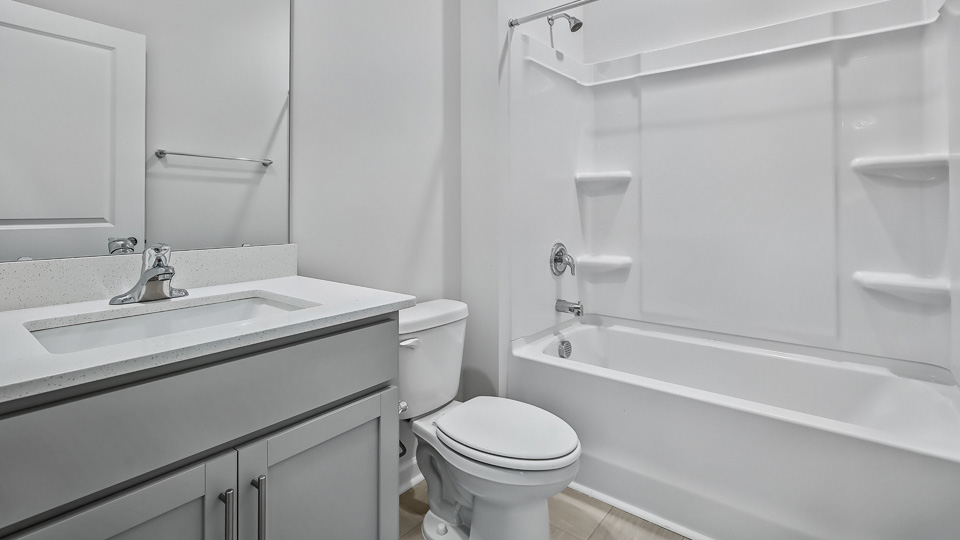 bathroom with tub shower combo