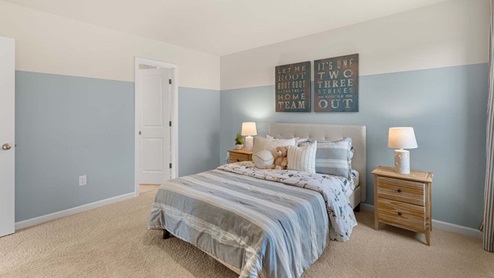 bedroom with carpet and natural light