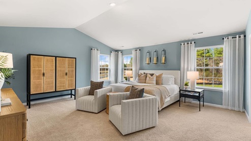 bedroom with carpet and natural light