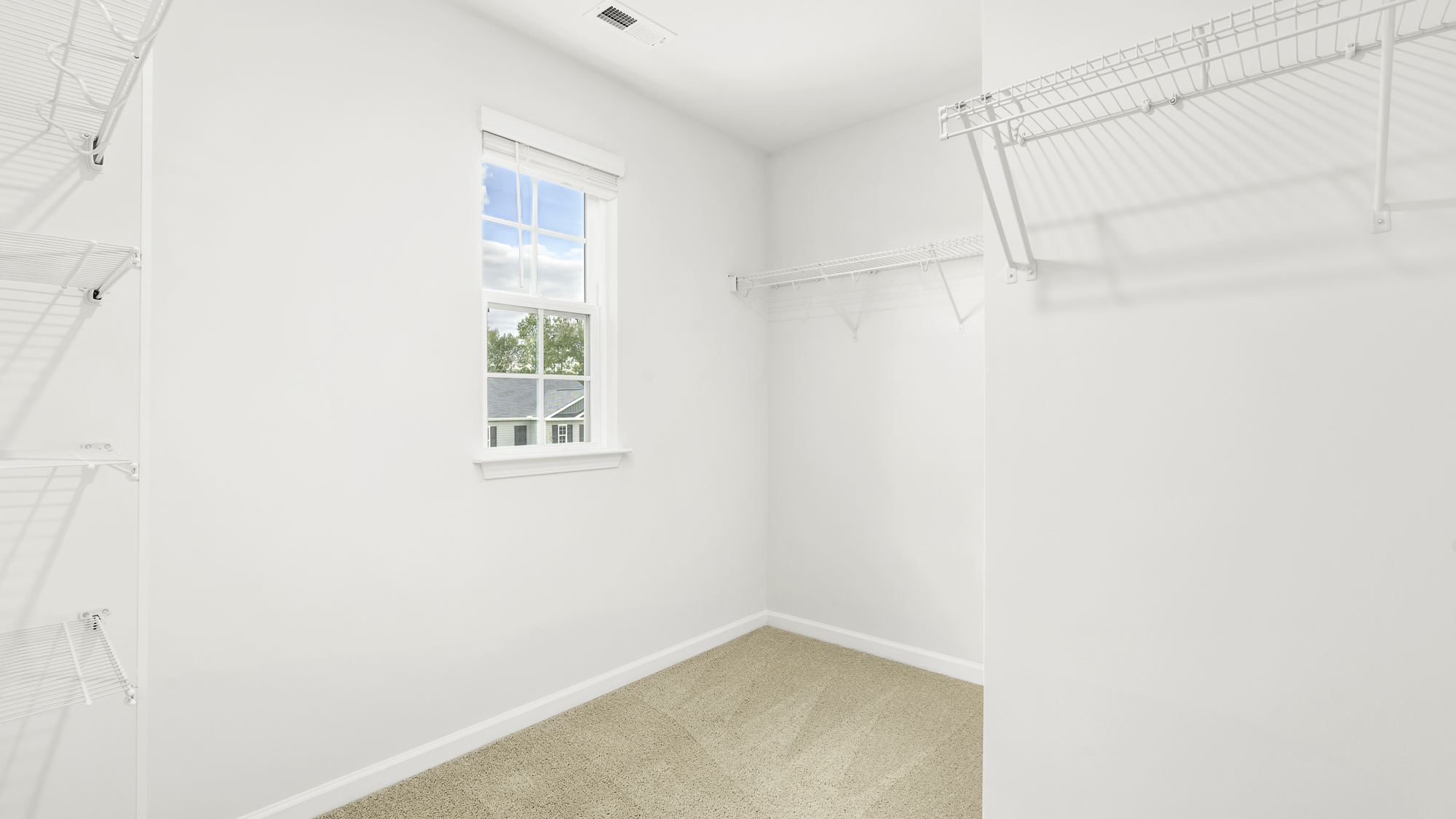 primary walk in closet with window