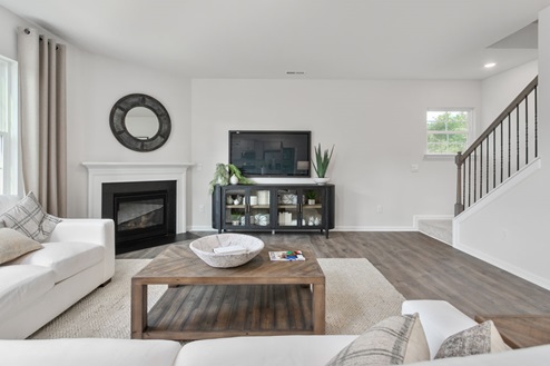 living room with revwood floors and natural light