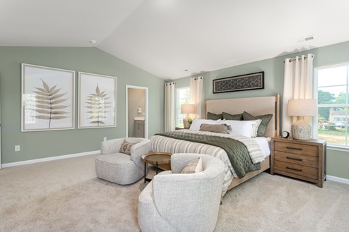 bedroom with carpet and natural light